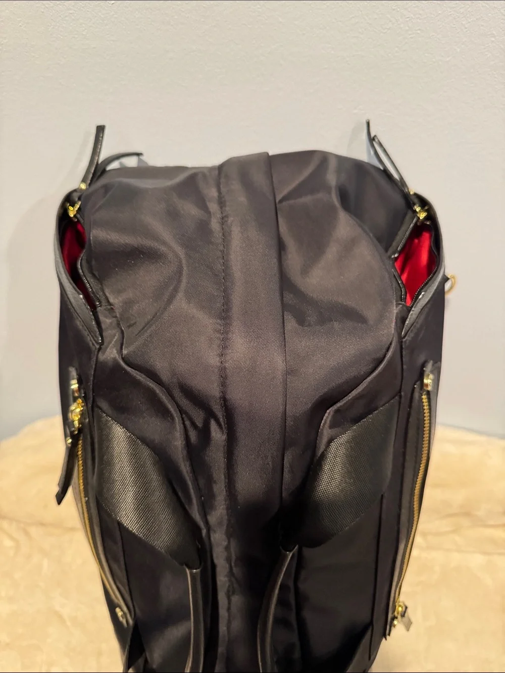Allancia Peyton black nylon backpack featuring striking gold-tone hardware. NEW